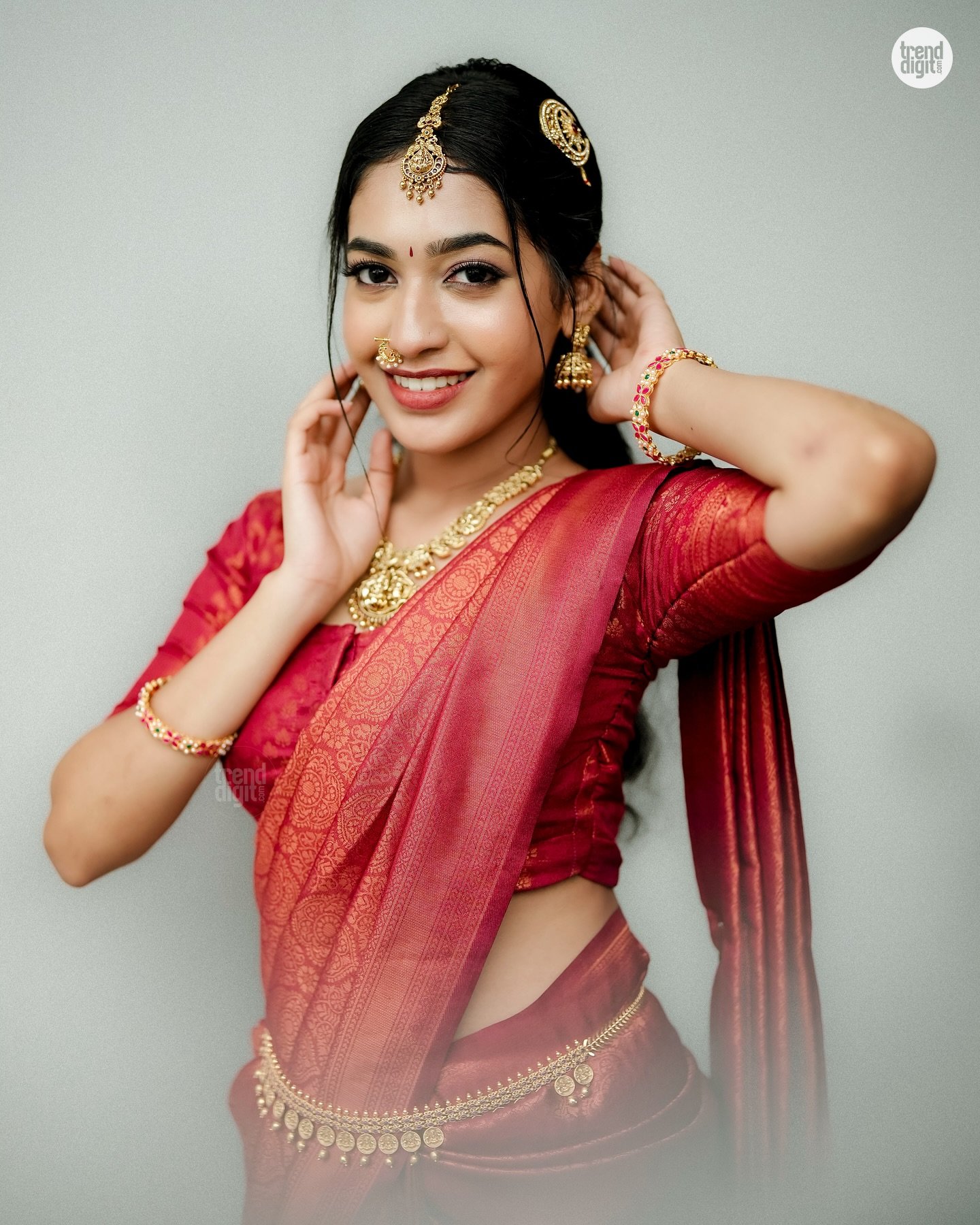Swathi Lekshmi Dazzles in a Red Silk Saree with Elegant Traditional Photoshoot Charm Image 1